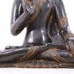 A serene gilt bronze statue of Gautama Buddha