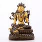 A serene gilt bronze green Tara statue