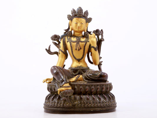 A serene gilt bronze green Tara statue