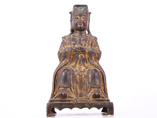 A serene gilt bronze statue of Wenquxing