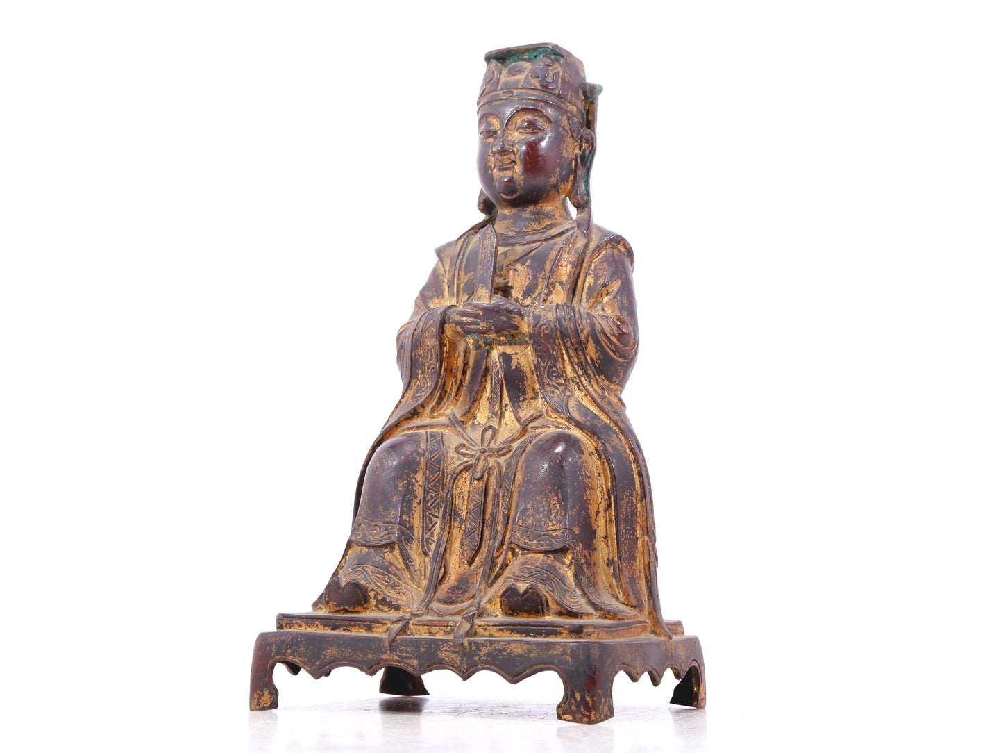 A serene gilt bronze statue of Wenquxing