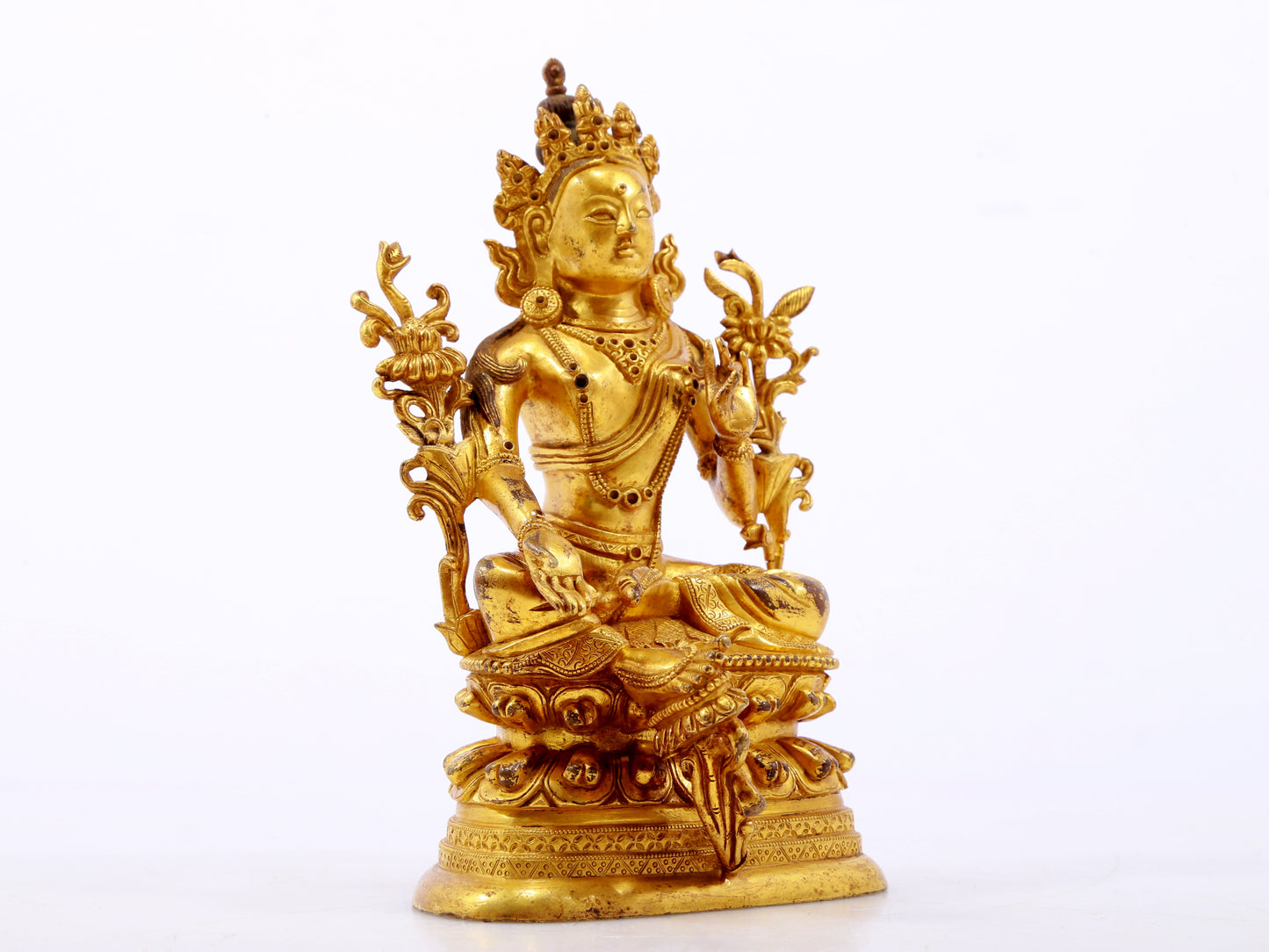 A serene gilt bronze green Tara statue