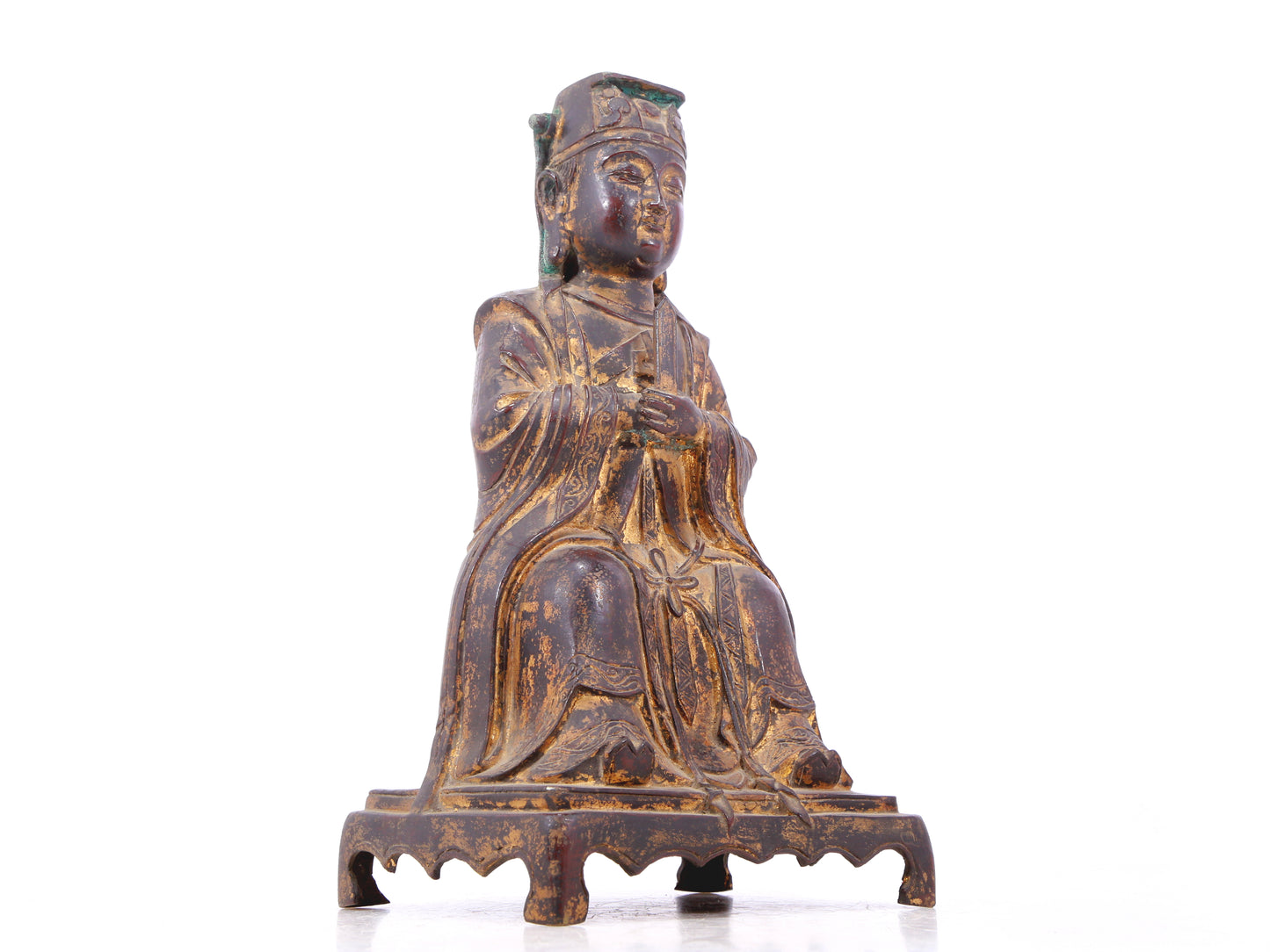 A serene gilt bronze statue of Wenquxing