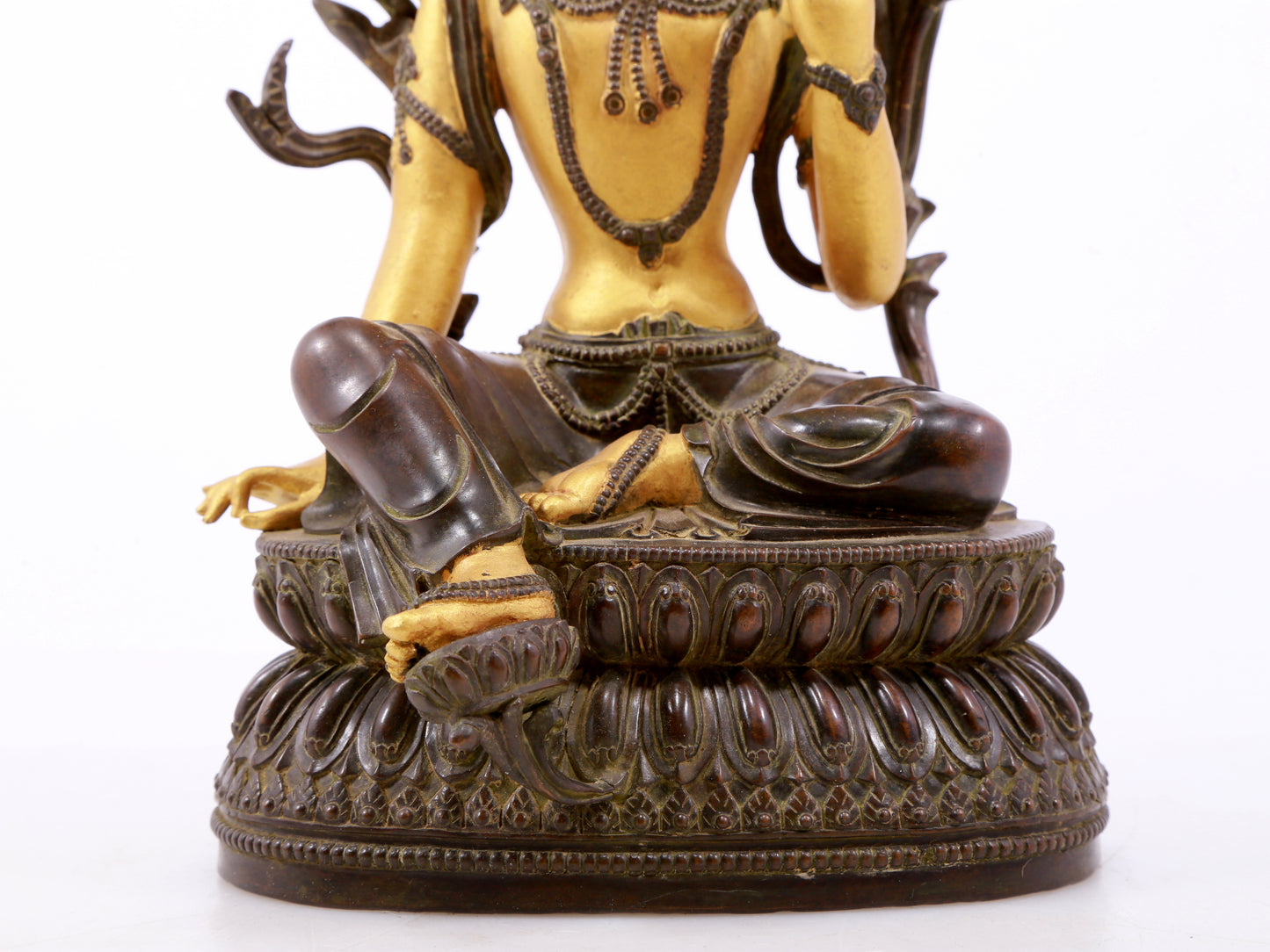 A serene gilt bronze green Tara statue