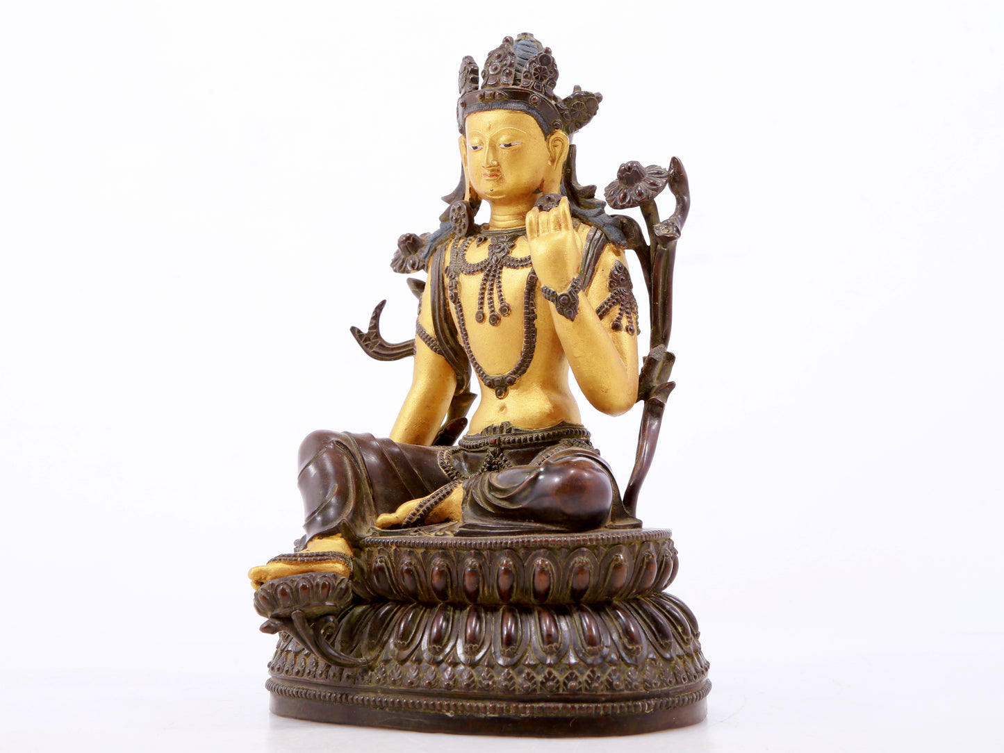 A serene gilt bronze green Tara statue