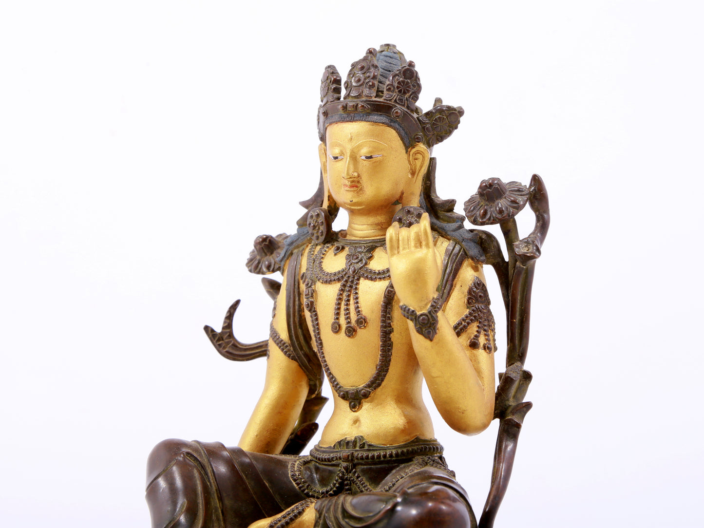 A serene gilt bronze green Tara statue