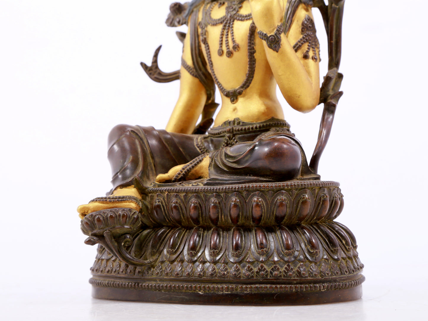 A serene gilt bronze green Tara statue