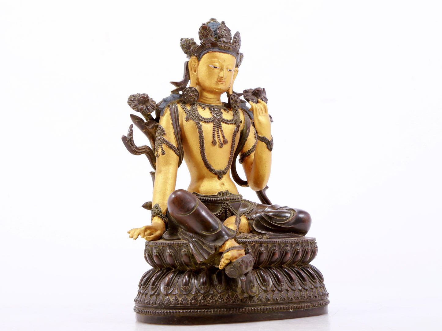 A serene gilt bronze green Tara statue