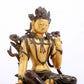 A serene gilt bronze green Tara statue