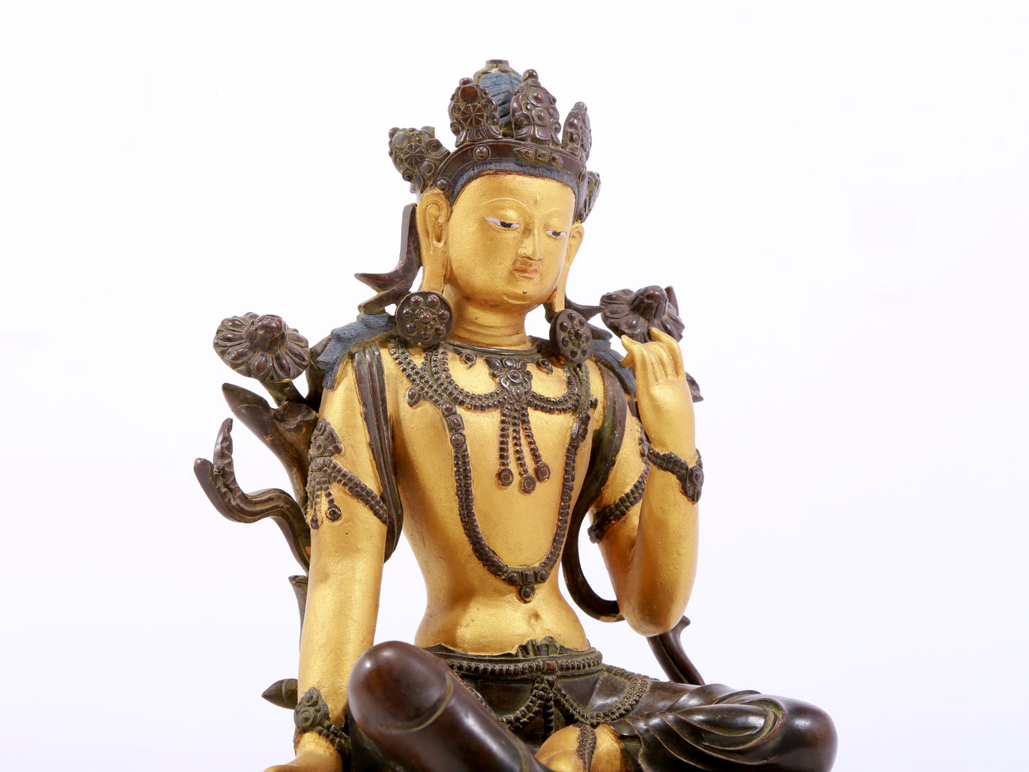 A serene gilt bronze green Tara statue