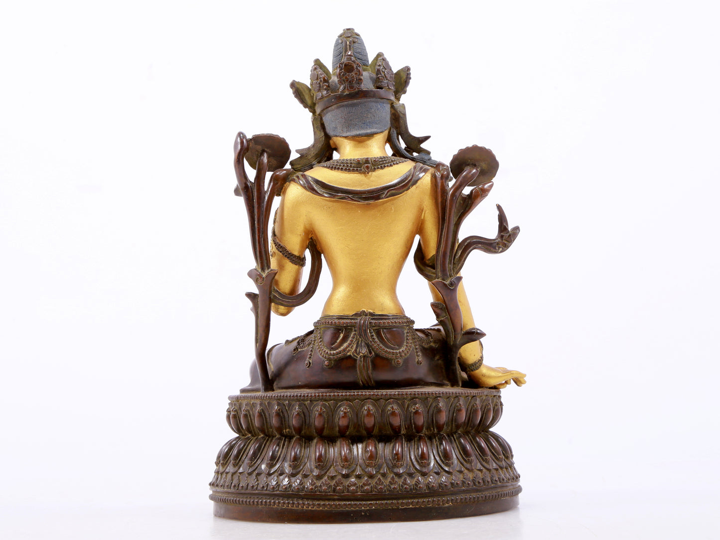 A serene gilt bronze green Tara statue