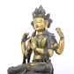 A serene gilt bronze four-armed Guanyin statue