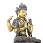 A serene gilt bronze four-armed Guanyin statue