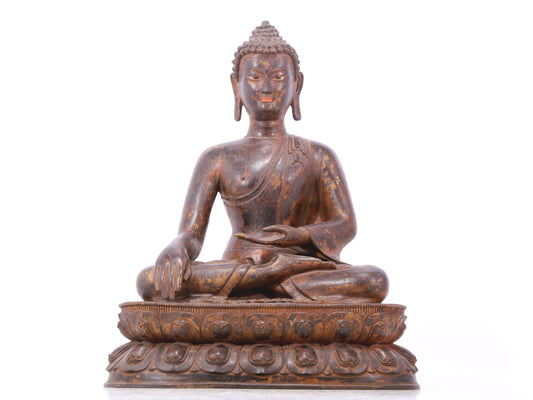 A serene gilt bronze statue of Gautama Buddha