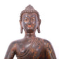 A serene gilt bronze statue of Gautama Buddha