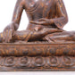 A serene gilt bronze statue of Gautama Buddha