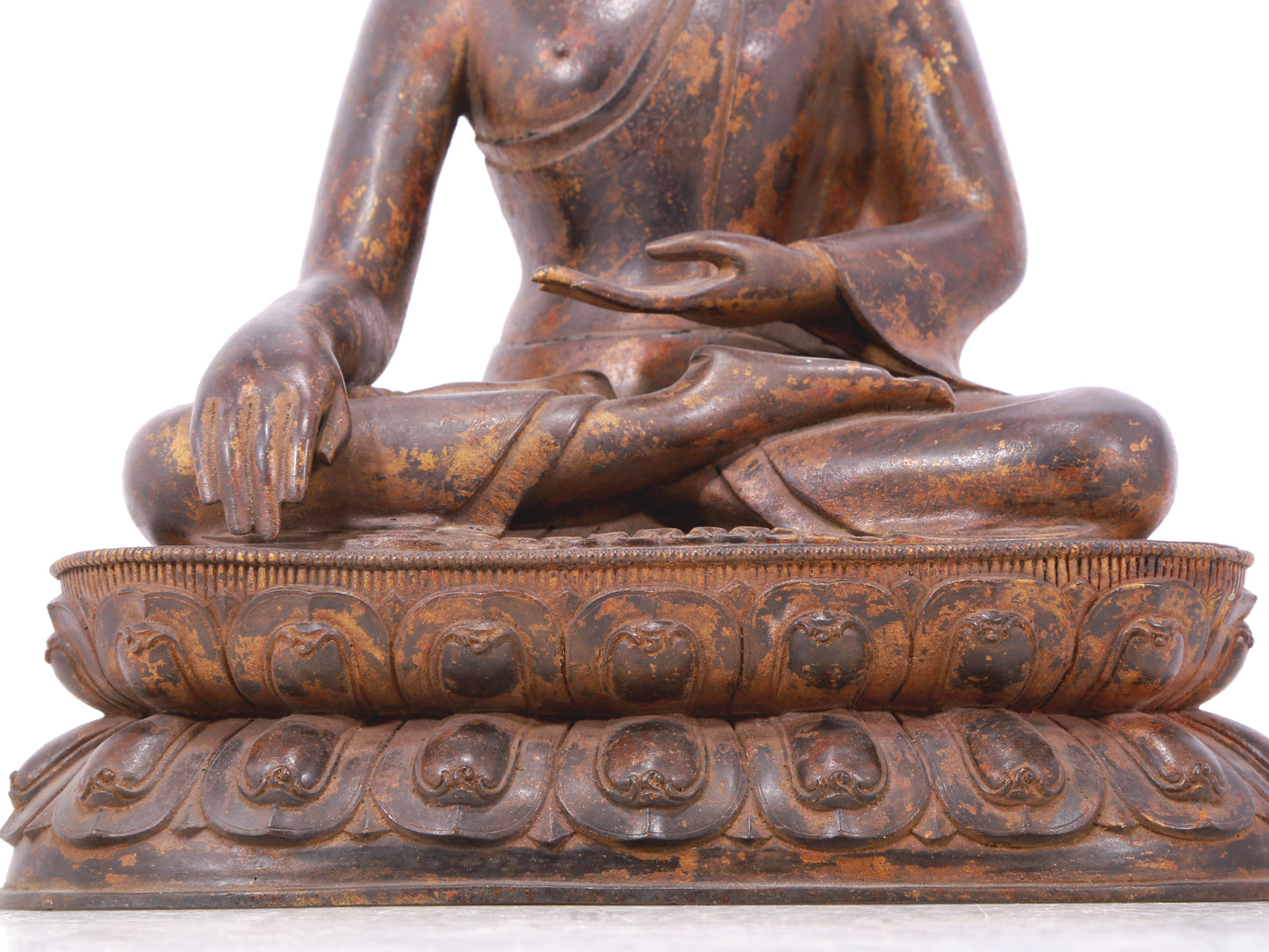 A serene gilt bronze statue of Gautama Buddha