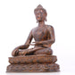 A serene gilt bronze statue of Gautama Buddha