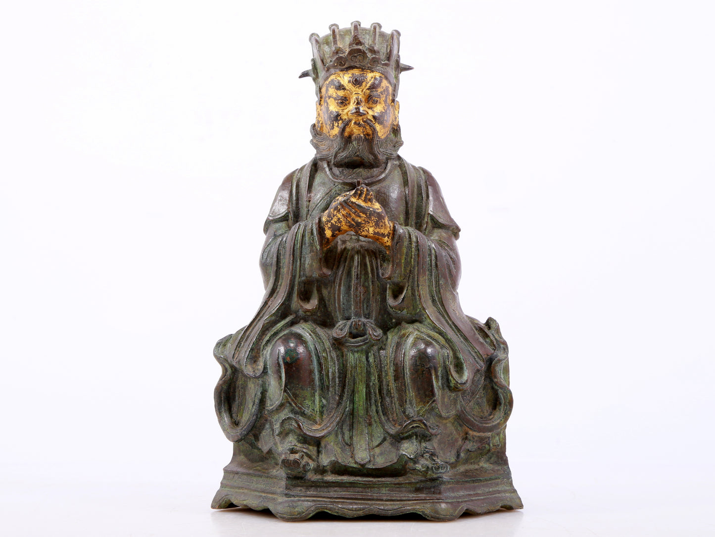 A serene gilt bronze figure