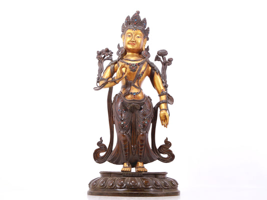 A serene gilt bronze statue of Tara