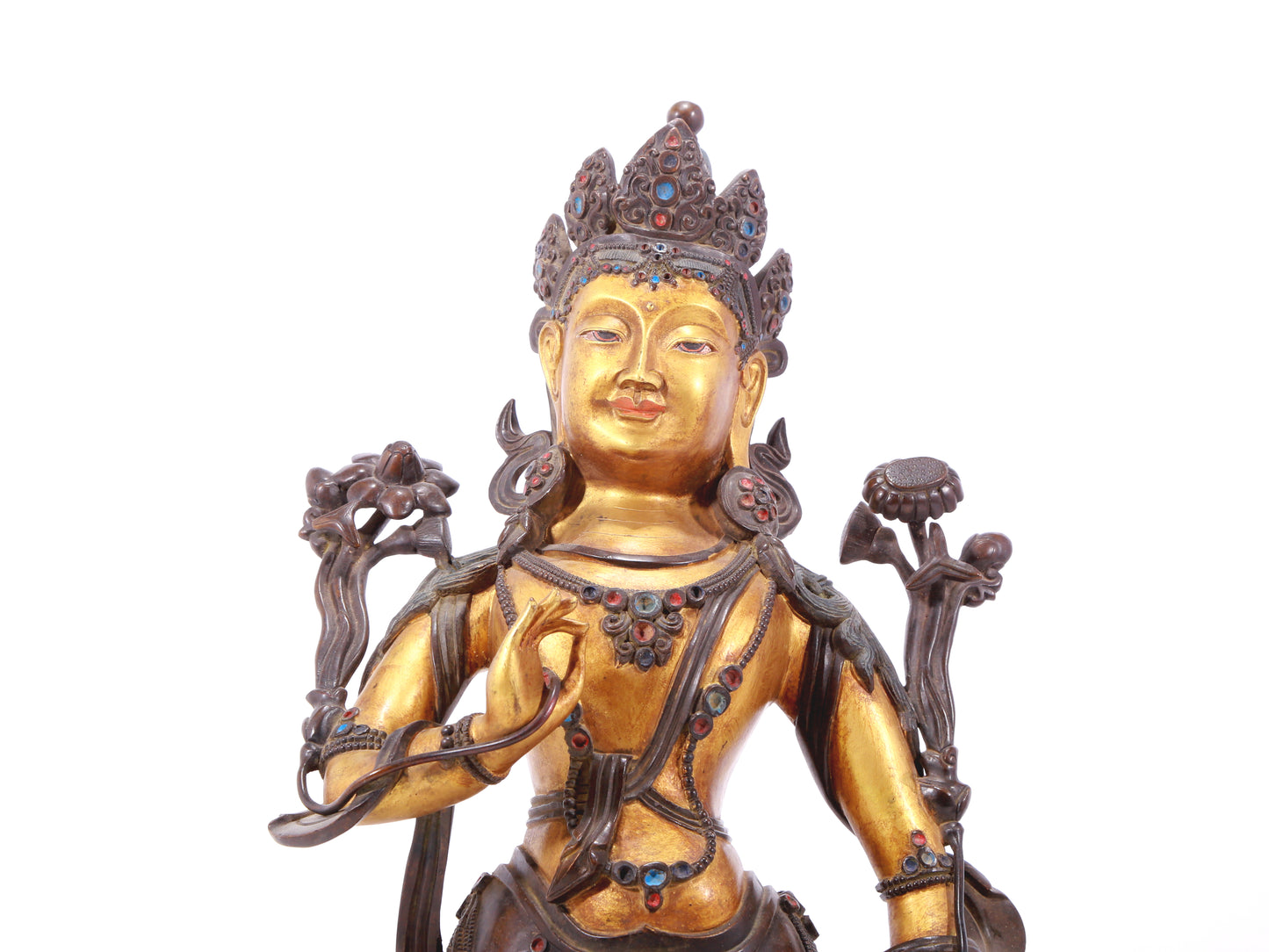 A serene gilt bronze statue of Tara