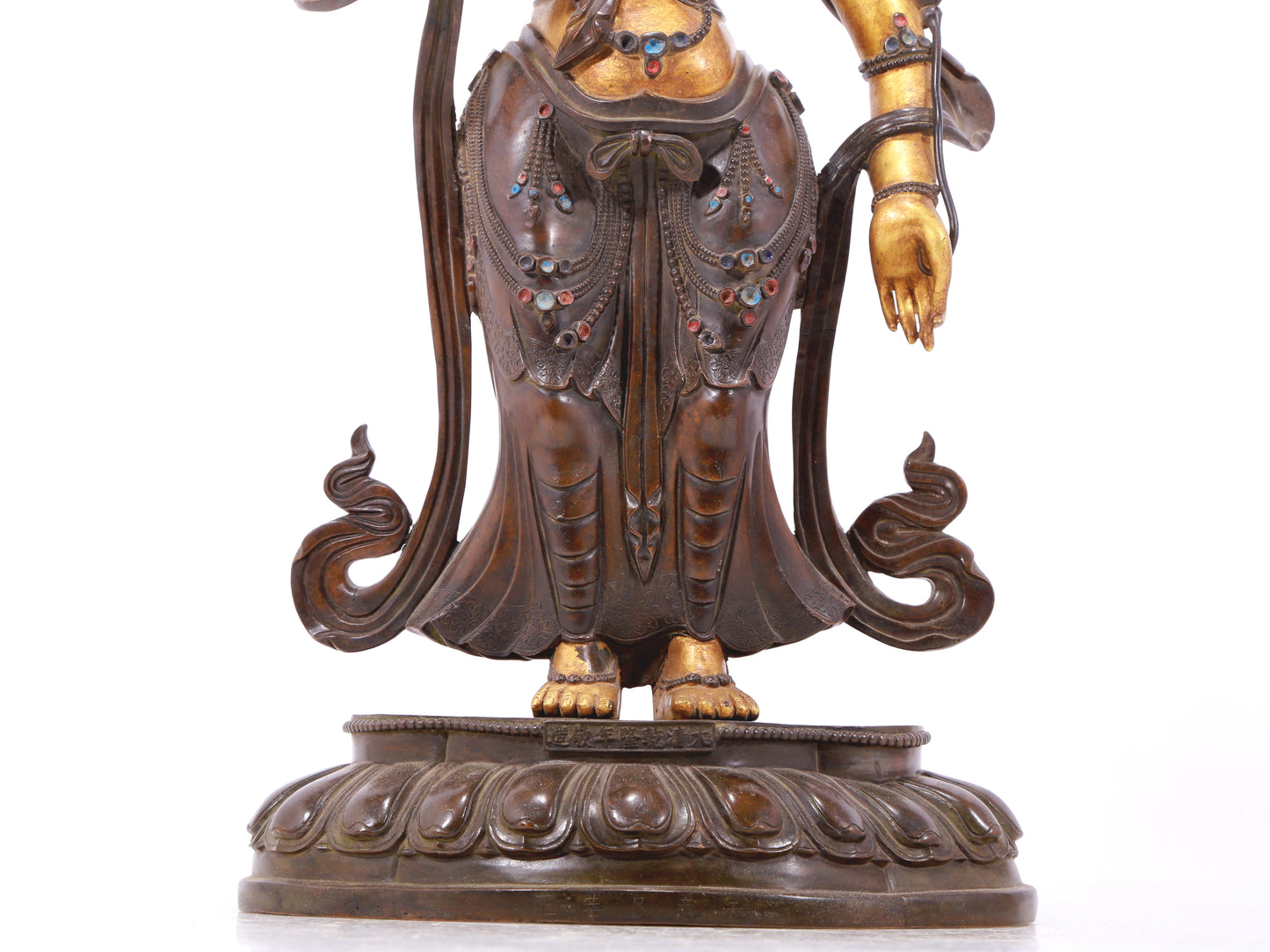 A serene gilt bronze statue of Tara