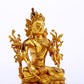 A serene gilt bronze green Tara statue