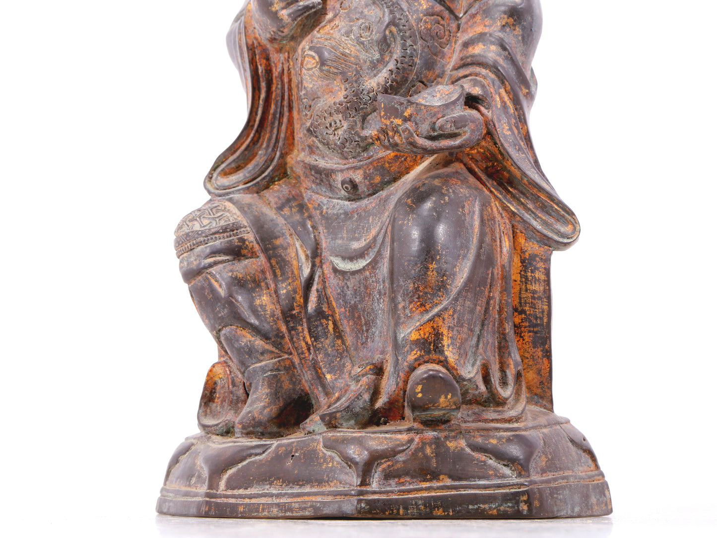 A serene gilt bronze statue of God of Wealth