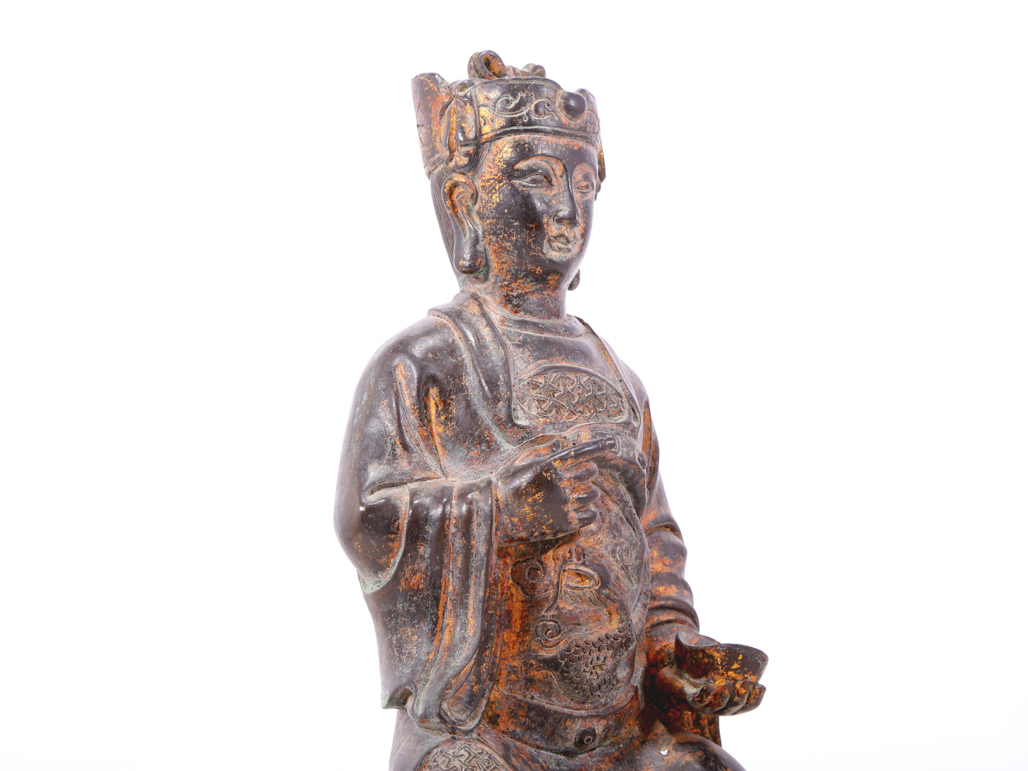 A serene gilt bronze statue of God of Wealth