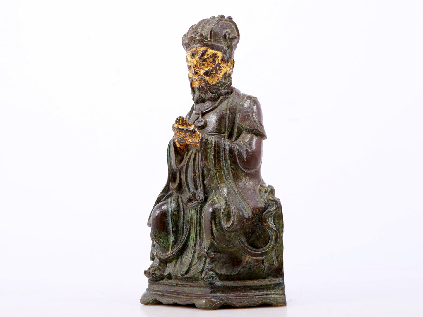 A serene gilt bronze figure