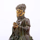 A serene gilt bronze figure