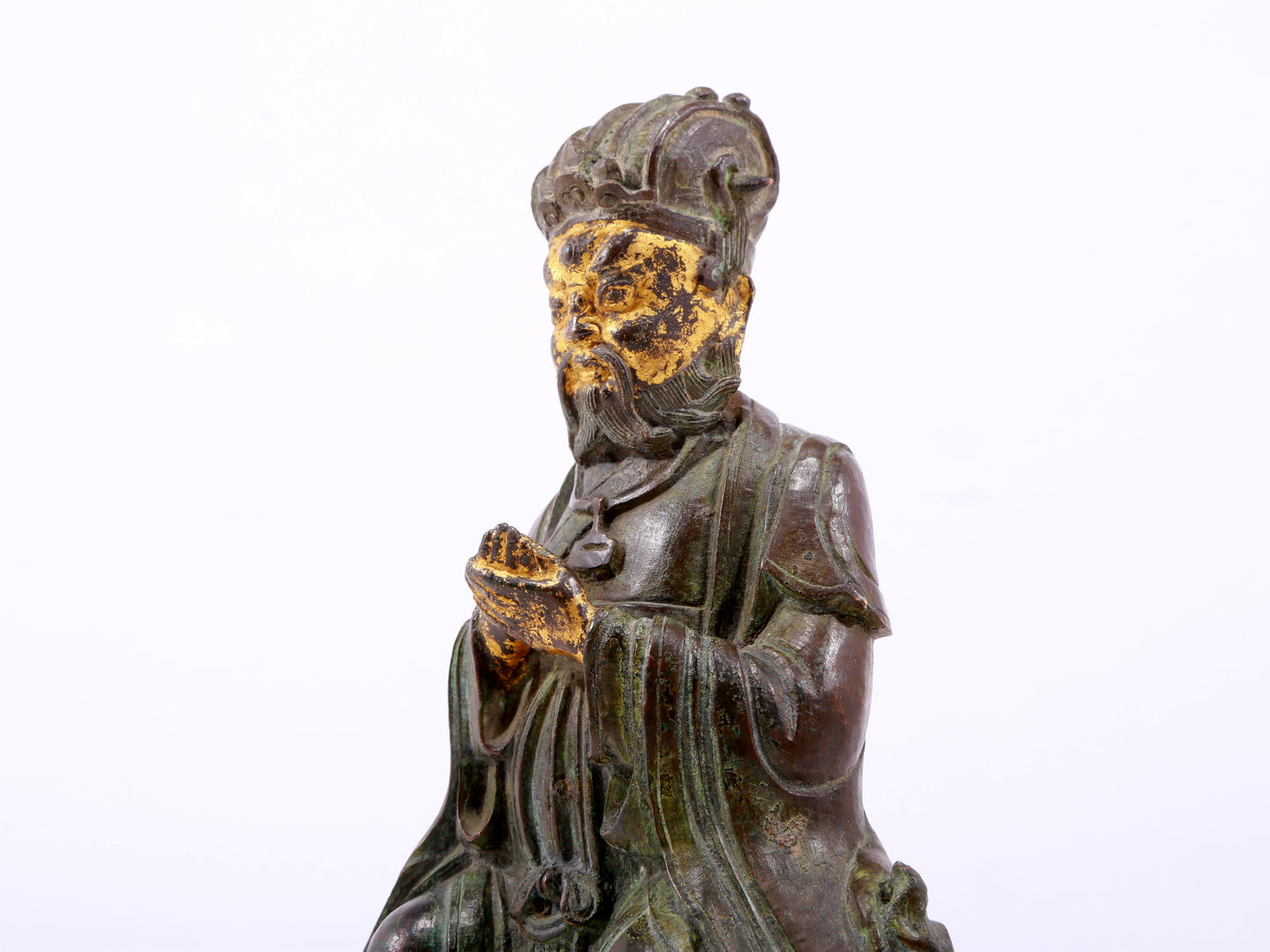 A serene gilt bronze figure