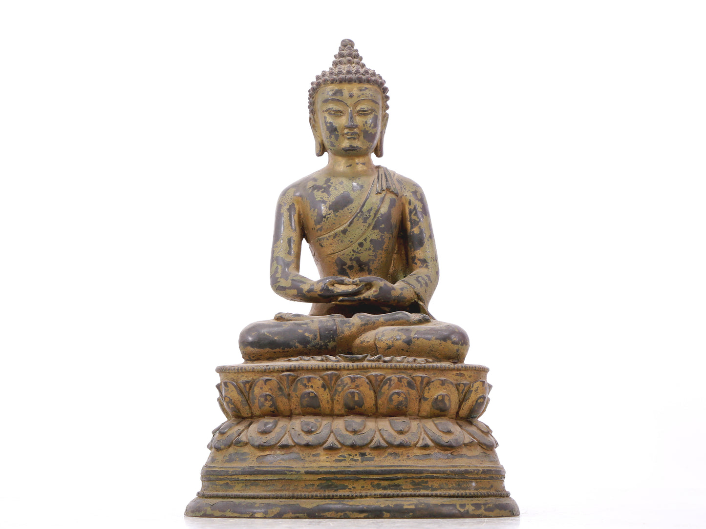 A serene gilt bronze statue of Gautama Buddha