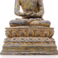 A serene gilt bronze statue of Gautama Buddha