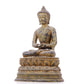 A serene gilt bronze statue of Gautama Buddha