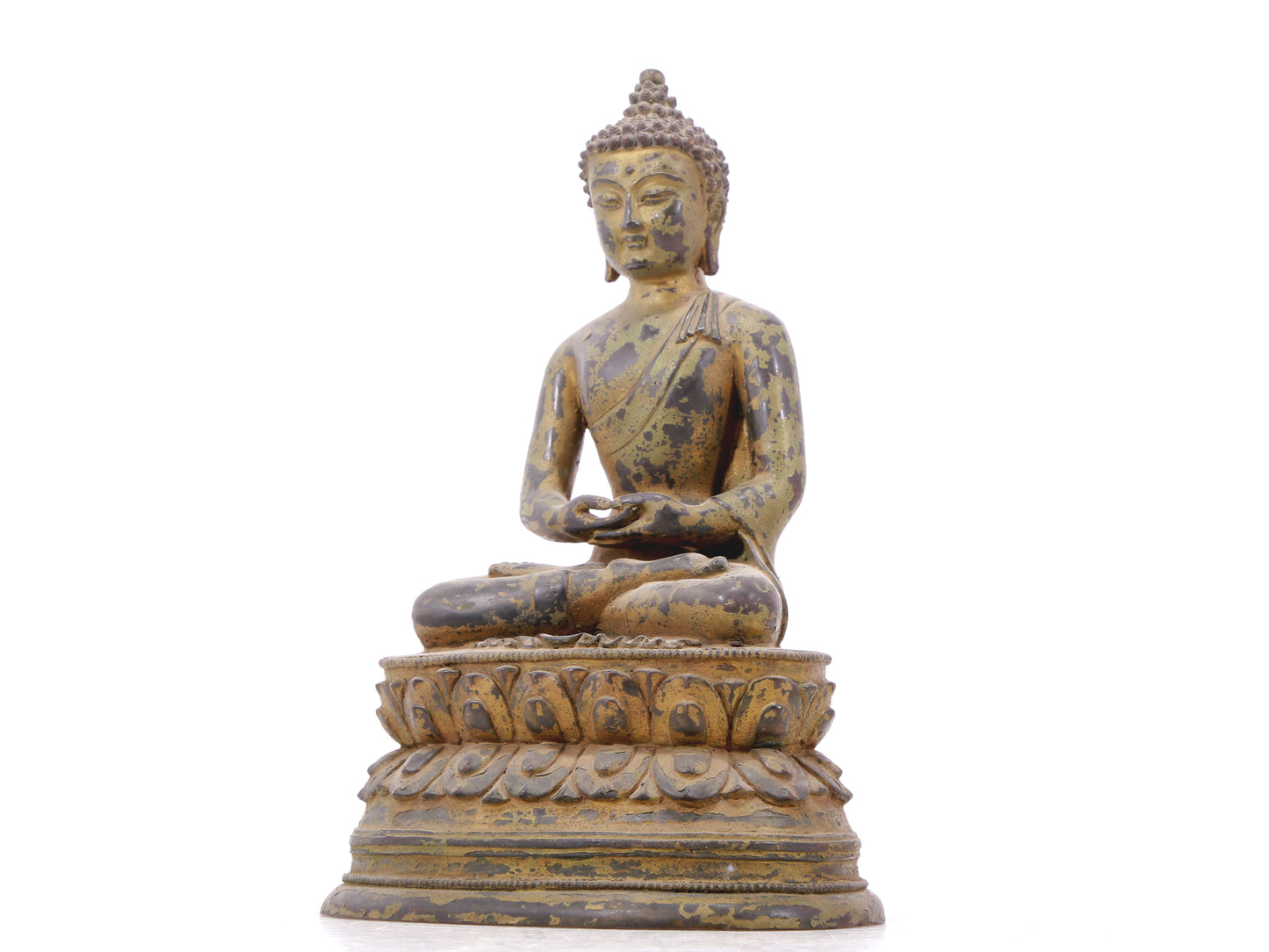 A serene gilt bronze statue of Gautama Buddha