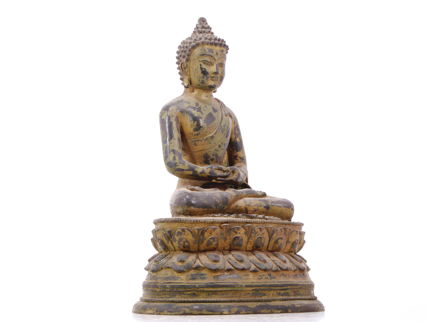 A serene gilt bronze statue of Gautama Buddha