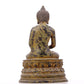 A serene gilt bronze statue of Gautama Buddha