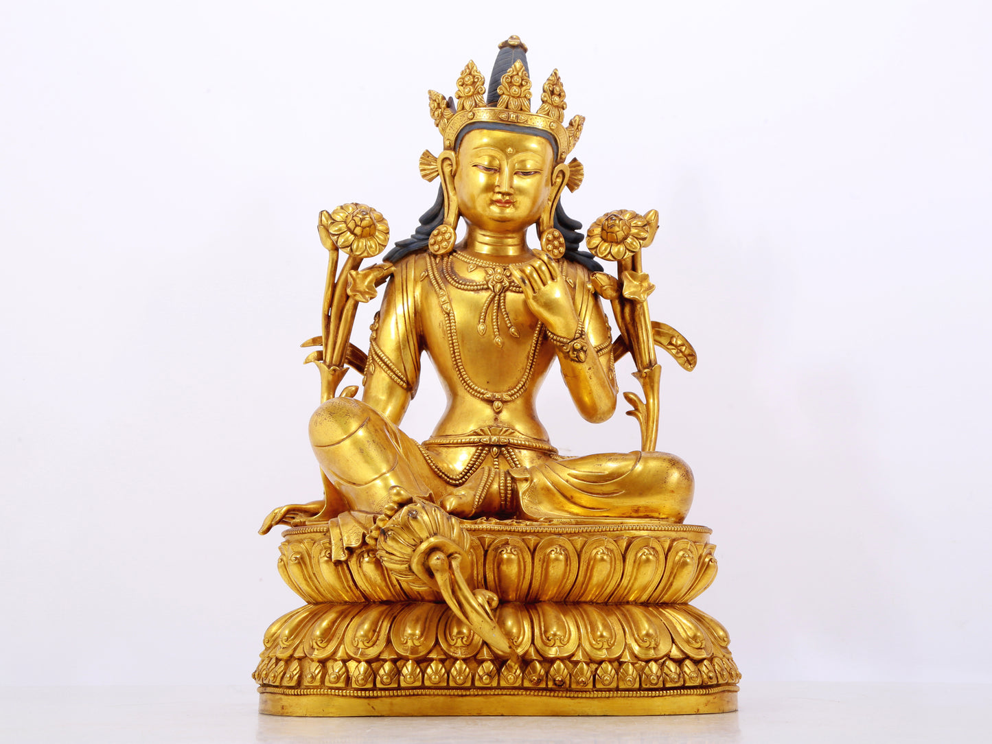 A stunning gilt bronze green Tara statue