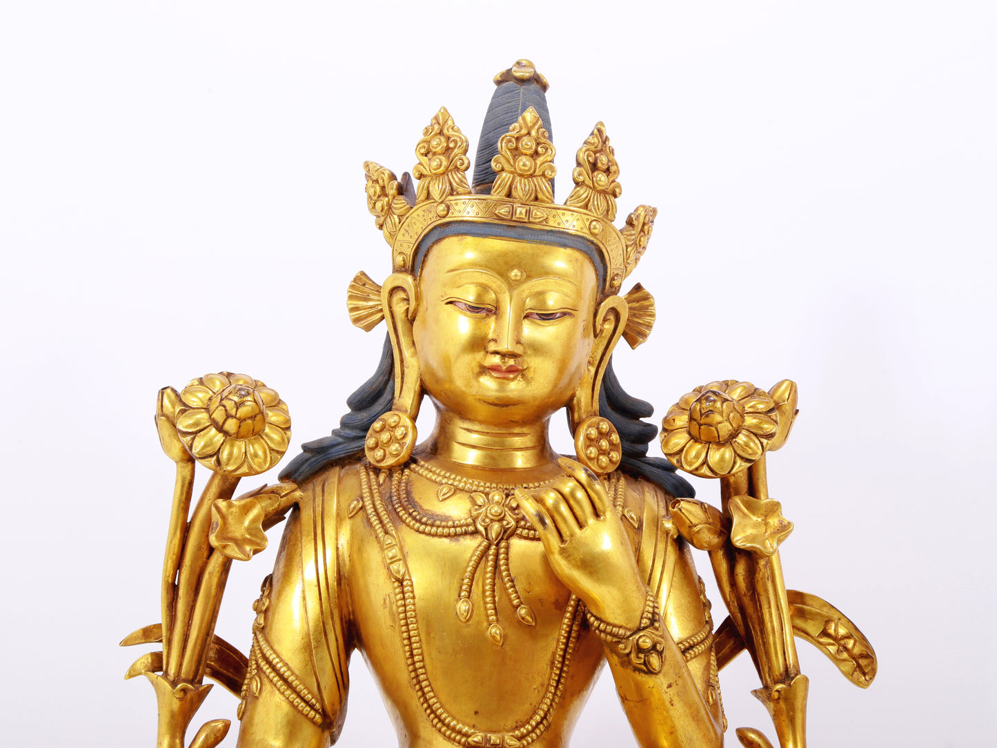 A stunning gilt bronze green Tara statue