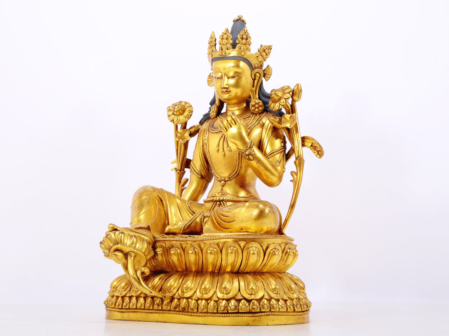 A stunning gilt bronze green Tara statue