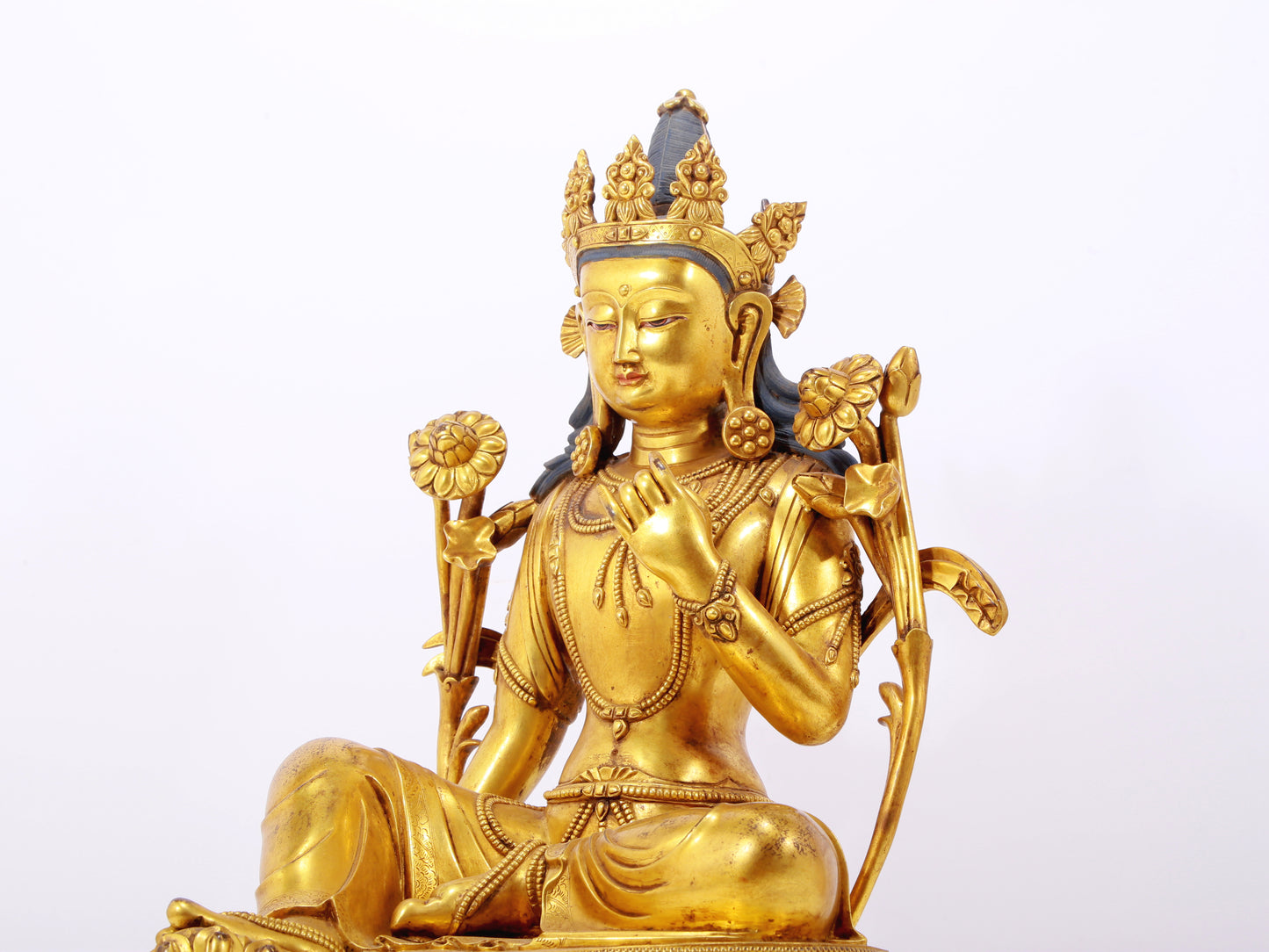 A stunning gilt bronze green Tara statue