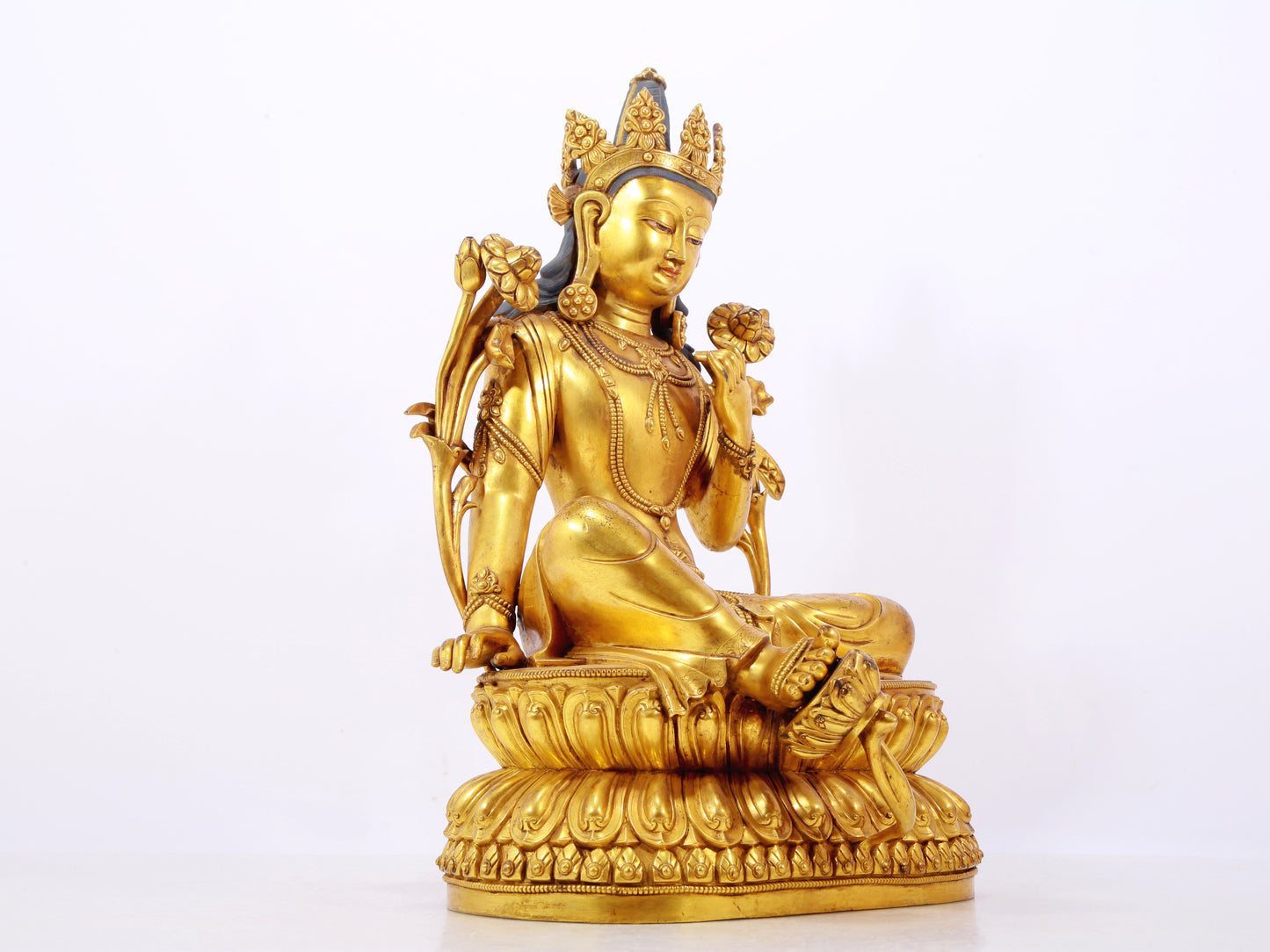 A stunning gilt bronze green Tara statue