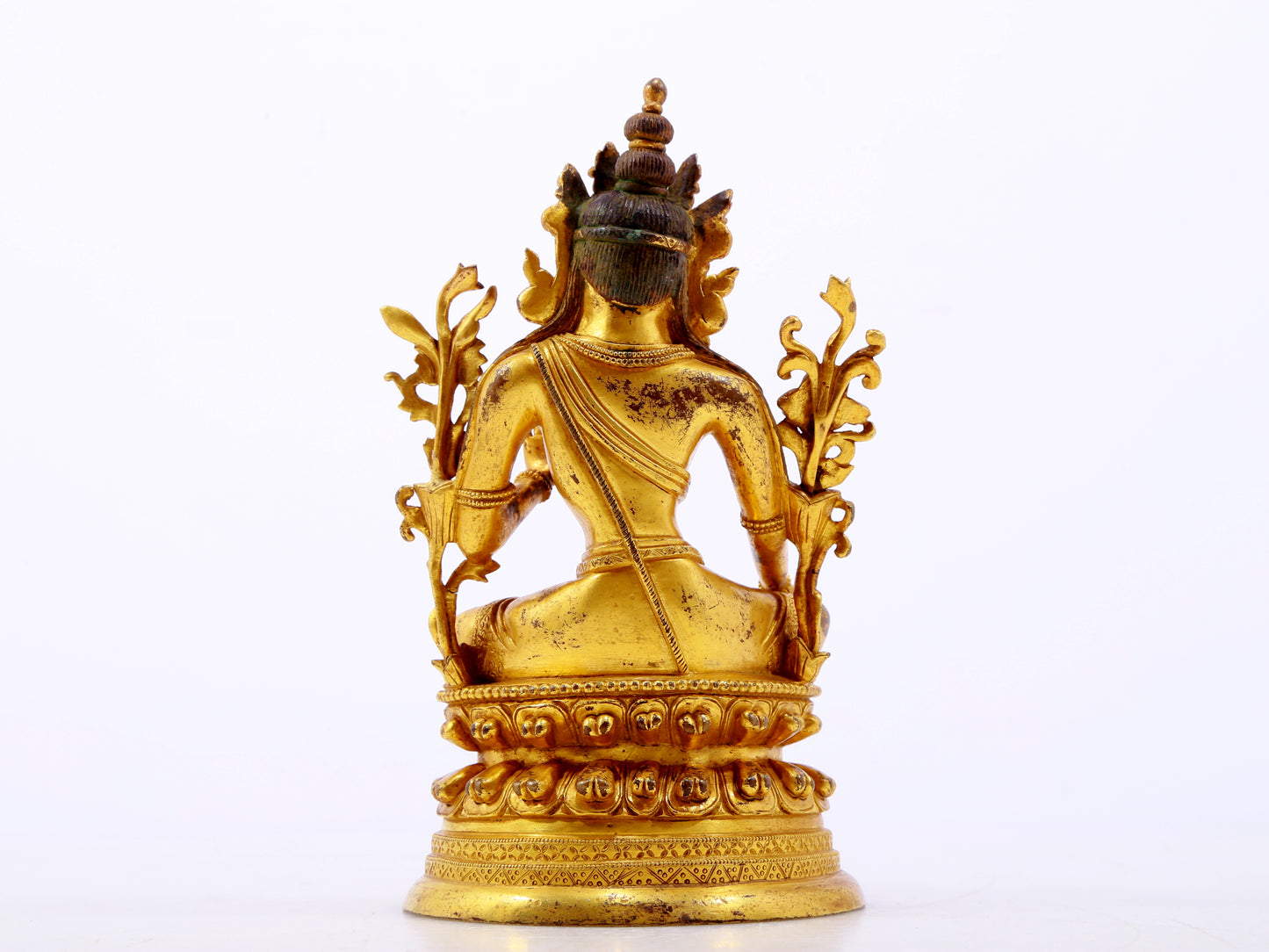 A serene gilt bronze green Tara statue