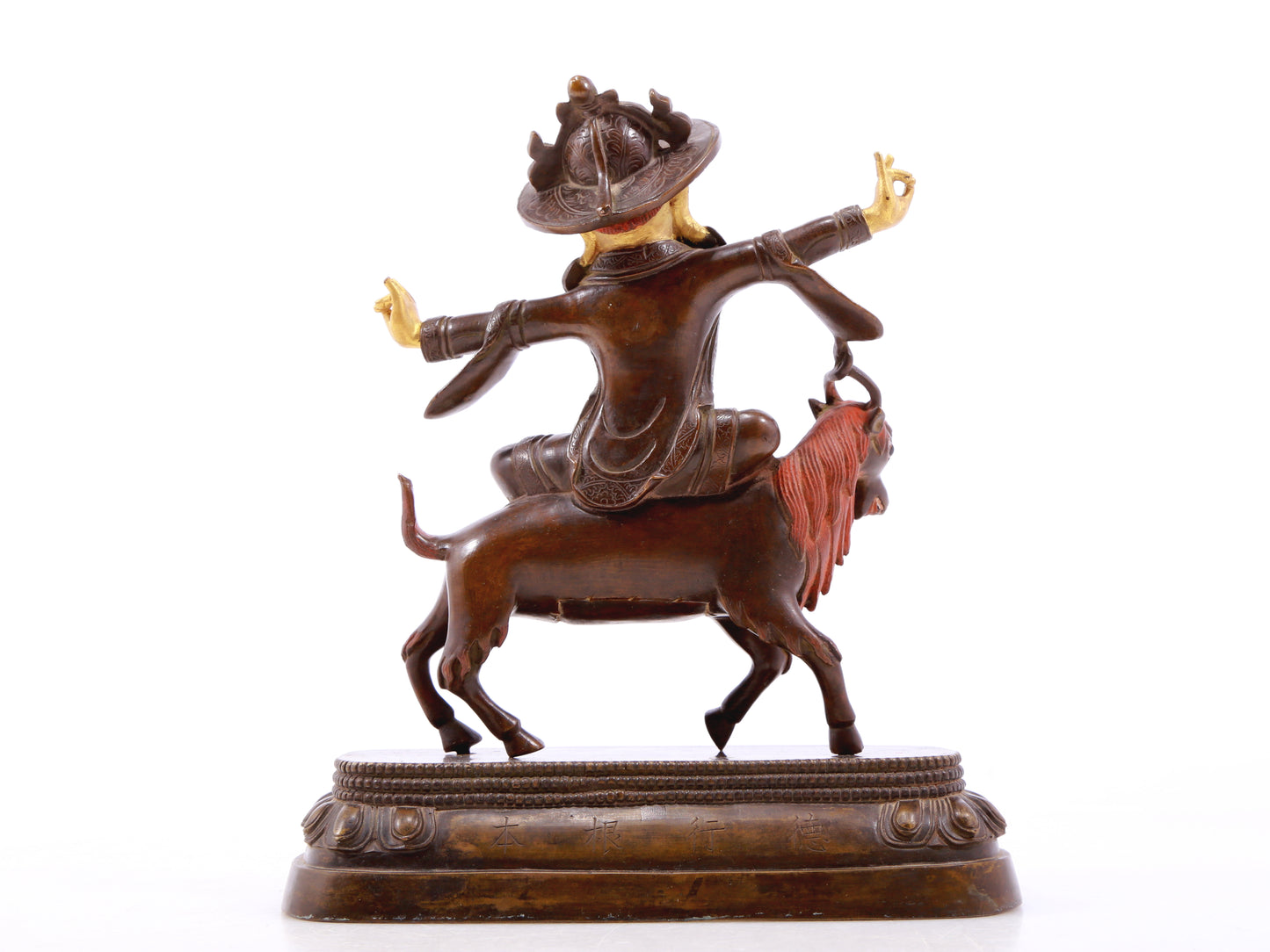 A serene gilt bronze protector statue