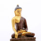 A serene gilt bronze statue of Gautama Buddha