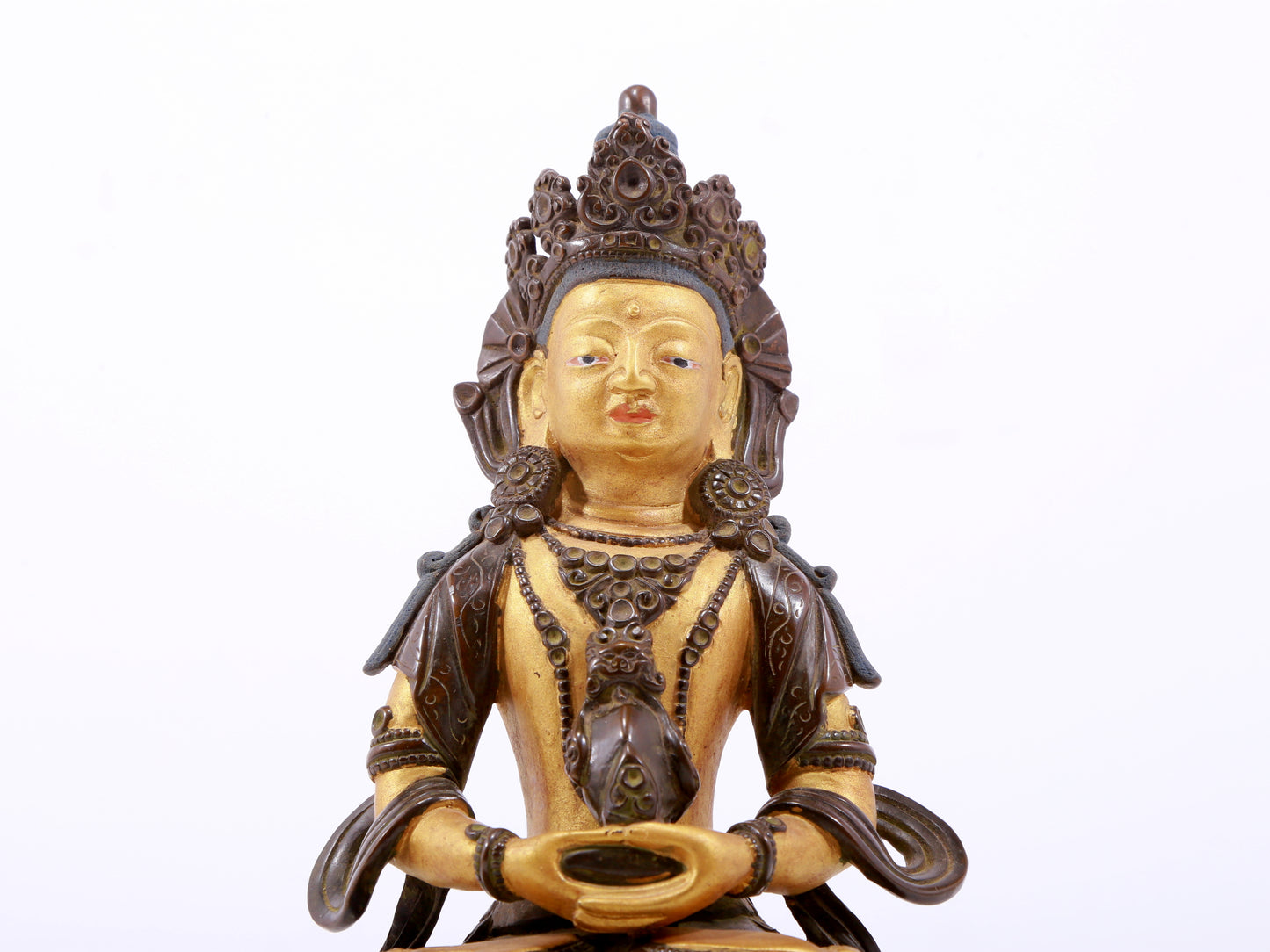 A serene gilt bronze statue of Amitayus Buddha