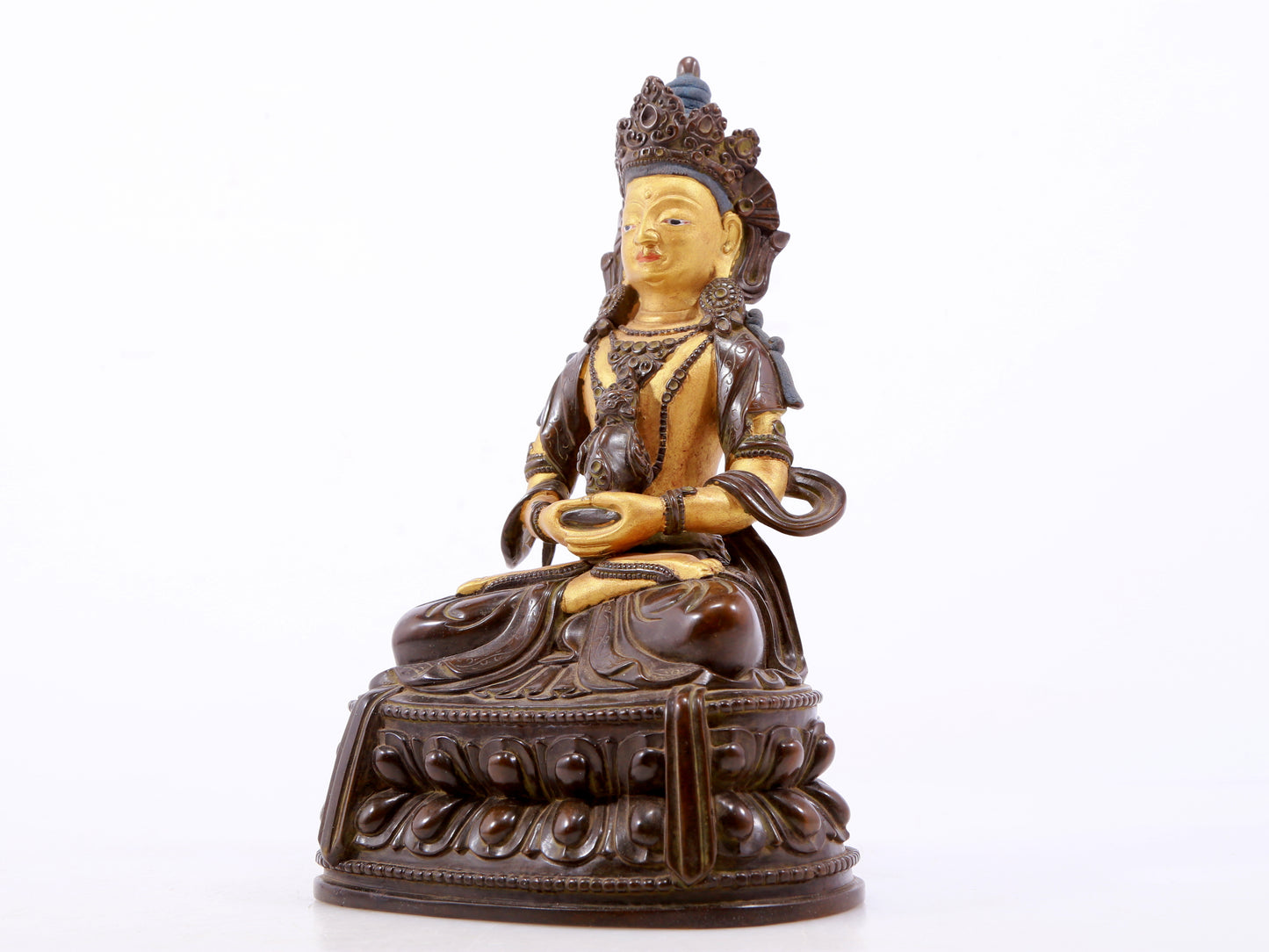 A serene gilt bronze statue of Amitayus Buddha