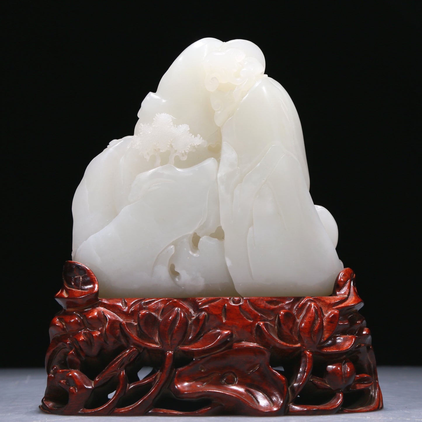 An Elaborate White Jade 'Figure' Decoration