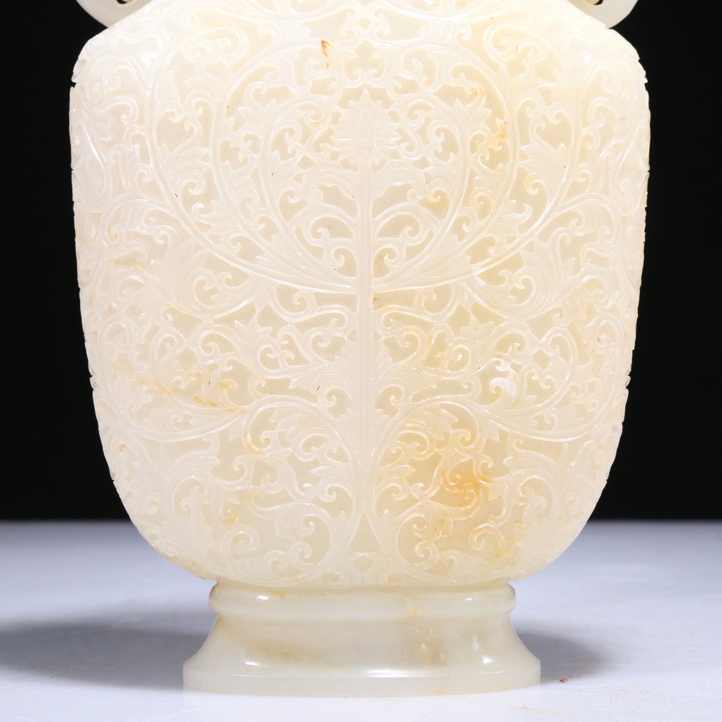 An Elaborate White Jade 'Scrolling Lotus' Elephant-Handled Vase